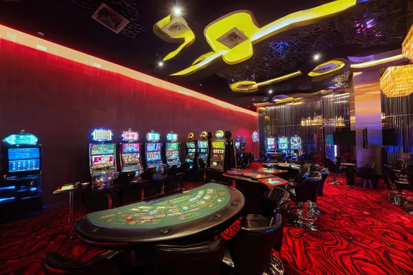 A glamorous woman holding casino chips in a neon-lit environment, representing the premium online casino atmosphere of JILI697.