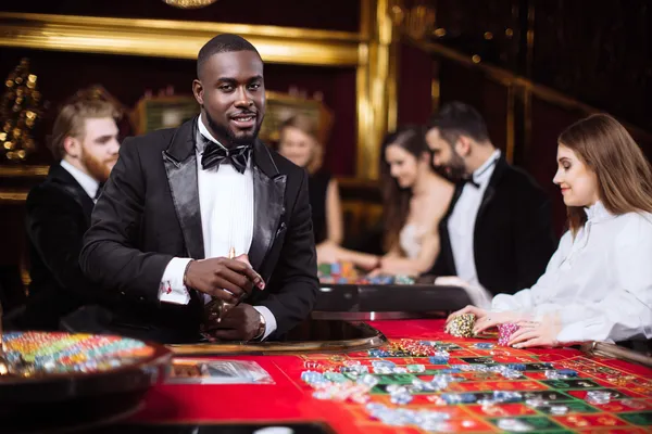 A dramatic shot of winning sevens landing on a slot reel surrounded by shining gold coins, symbolizing big wins.